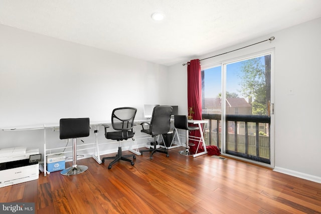 home office featuring baseboards, recessed lighting, and wood finished floors