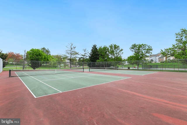 view of sport court with fence