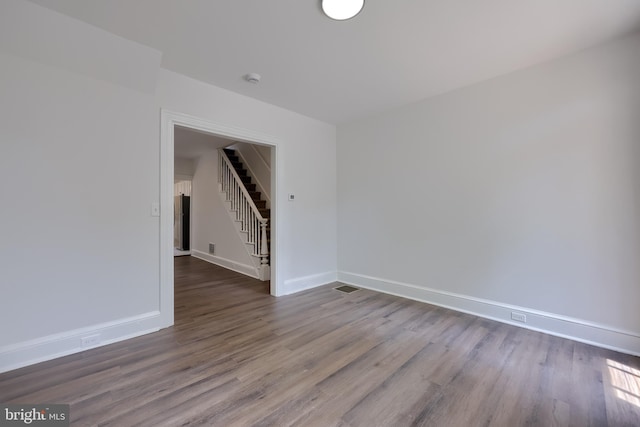 311 E Frederick St, Lancaster, PA 17602 - unfurnished room featuring stairs and wood finished floors