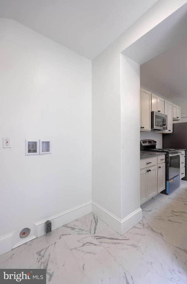 311 E Frederick St, Lancaster, PA 17602 - laundry area with light marble finish floors and baseboards