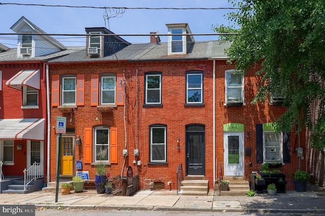 311 E Frederick St, Lancaster, PA 17602 - view of property featuring brick siding, entry steps, and roof with shingles