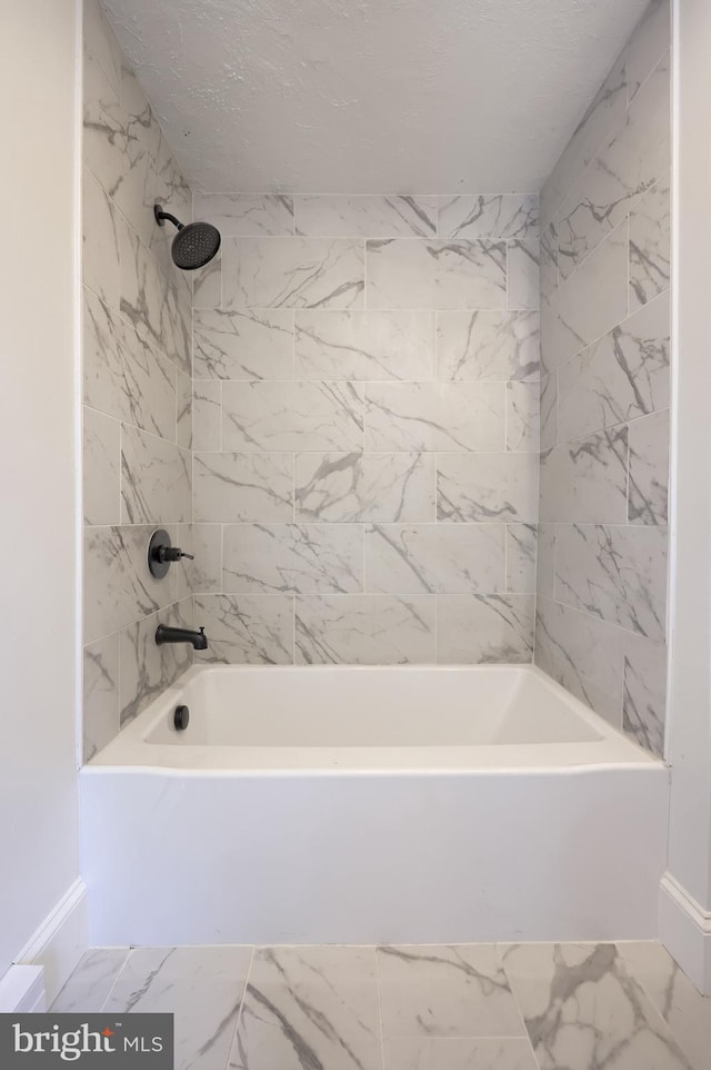 311 E Frederick St, Lancaster, PA 17602 - bathroom featuring marble look tiles and tub / shower combination