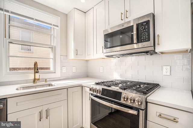 3839 Chalfont Dr, Philadelphia, PA 19154 - kitchen featuring backsplash, white cabinetry, stainless steel appliances, and a sink
