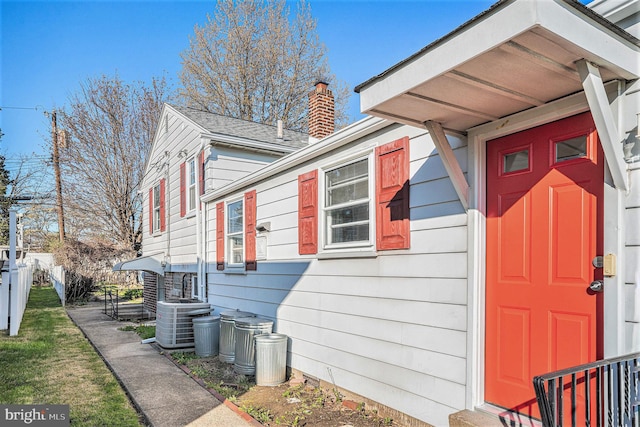 3839 Chalfont Dr, Philadelphia, PA 19154 - view of property exterior featuring cooling unit, a chimney, and fence