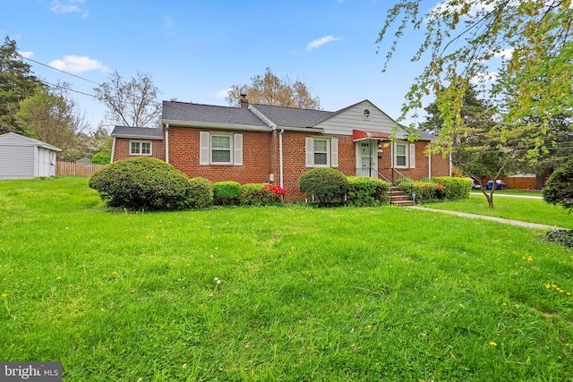single story home with a front lawn, a chimney, and brick siding
