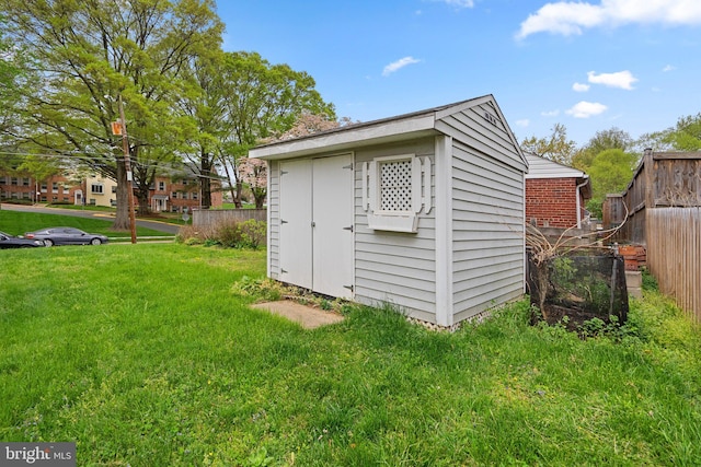 view of shed with fence