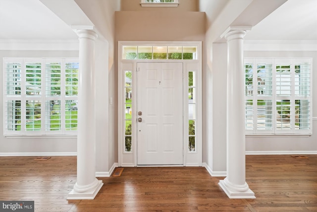 5856 Kittewan Ct, Manassas, VA 20112 - entrance foyer with ornate columns, wood finished floors, plenty of natural light, ornamental molding, and baseboards