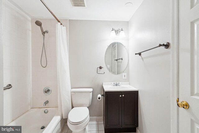 5856 Kittewan Ct, Manassas, VA 20112 - full bath with toilet, tile patterned floors, vanity, shower / bath combo with shower curtain, and baseboards