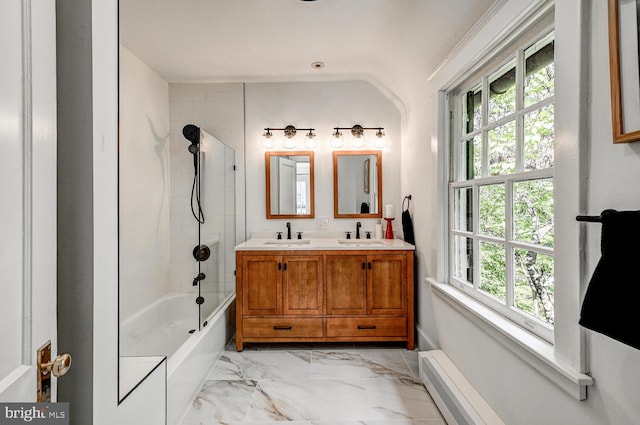 bathroom with a sink, washtub / shower combination, double vanity, and marble finish floor