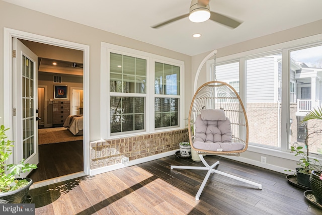sunroom / solarium with visible vents and a healthy amount of sunlight