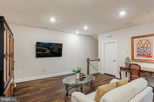 living room with baseboards, visible vents, and dark wood-style floors