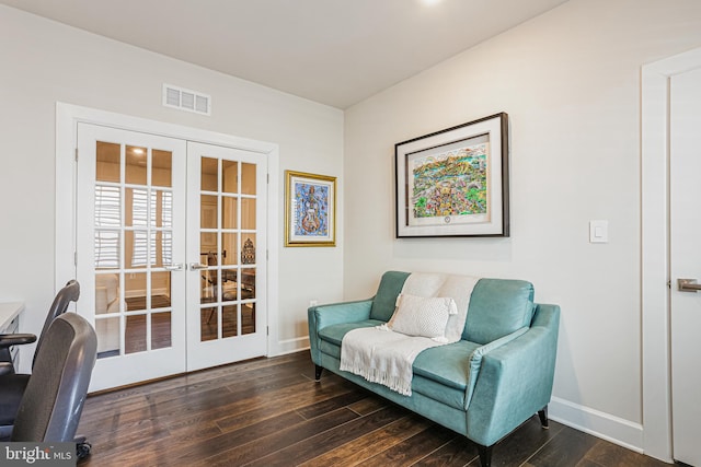 sitting room featuring wood-type flooring, baseboards, french doors, and visible vents