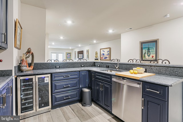 kitchen with stainless steel dishwasher, a sink, beverage cooler, light wood finished floors, and recessed lighting
