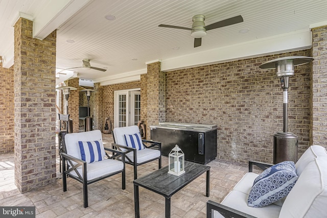 view of patio featuring an outdoor living space and ceiling fan