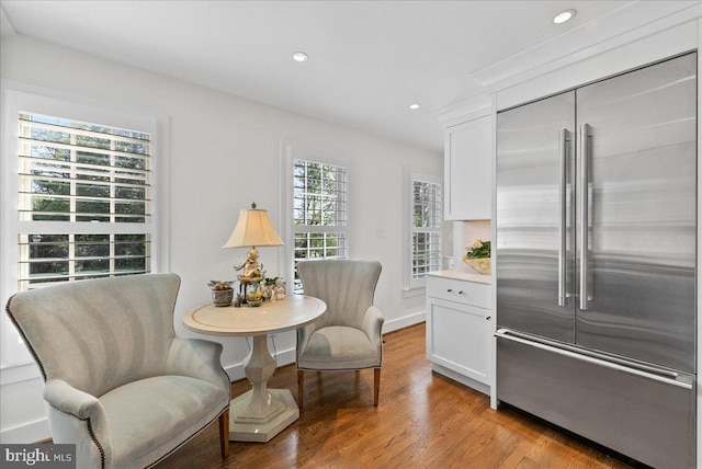 living area featuring recessed lighting and light wood finished floors