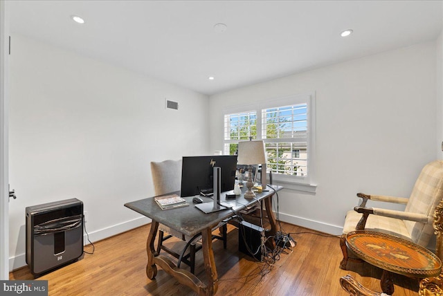 home office featuring visible vents, recessed lighting, baseboards, and light wood finished floors