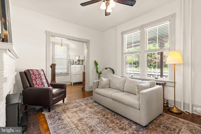 4916 40th Pl, Hyattsville, MD 20781 - living area with a ceiling fan, wood finished floors, and a fireplace