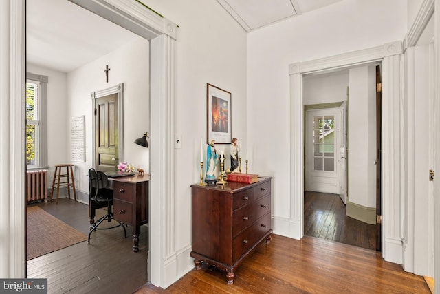 4916 40th Pl, Hyattsville, MD 20781 - corridor featuring dark wood-style floors, radiator, and baseboards