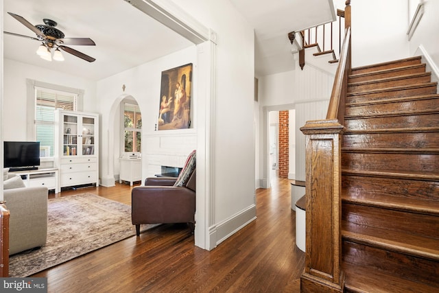 4916 40th Pl, Hyattsville, MD 20781 - stairs featuring arched walkways, ceiling fan, and wood finished floors