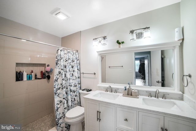 11326 Appledowre Way Unit 154, Germantown, MD 20876 - bathroom featuring tiled shower, double vanity, and toilet