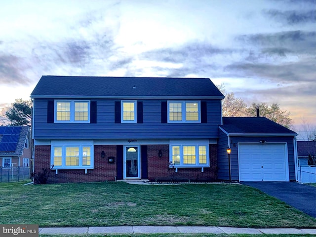 18 Grayson Cir, Willingboro, NJ 08046 - colonial inspired home with a lawn, fence, aphalt driveway, and an attached garage