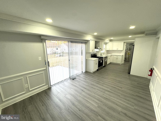 18 Grayson Cir, Willingboro, NJ 08046 - kitchen with crown molding, stainless steel gas stove, wall chimney range hood, and light countertops