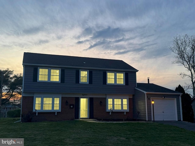 18 Grayson Cir, Willingboro, NJ 08046 - colonial inspired home featuring driveway, a front lawn, brick siding, and an attached garage