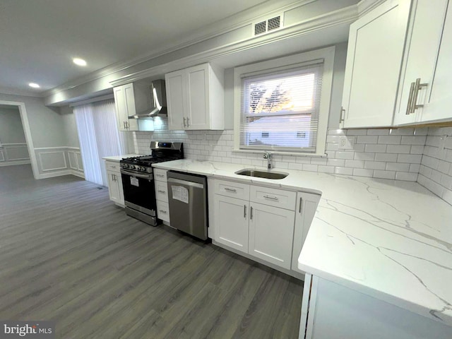 18 Grayson Cir, Willingboro, NJ 08046 - kitchen with light stone countertops, a sink, wall chimney exhaust hood, ornamental molding, and appliances with stainless steel finishes