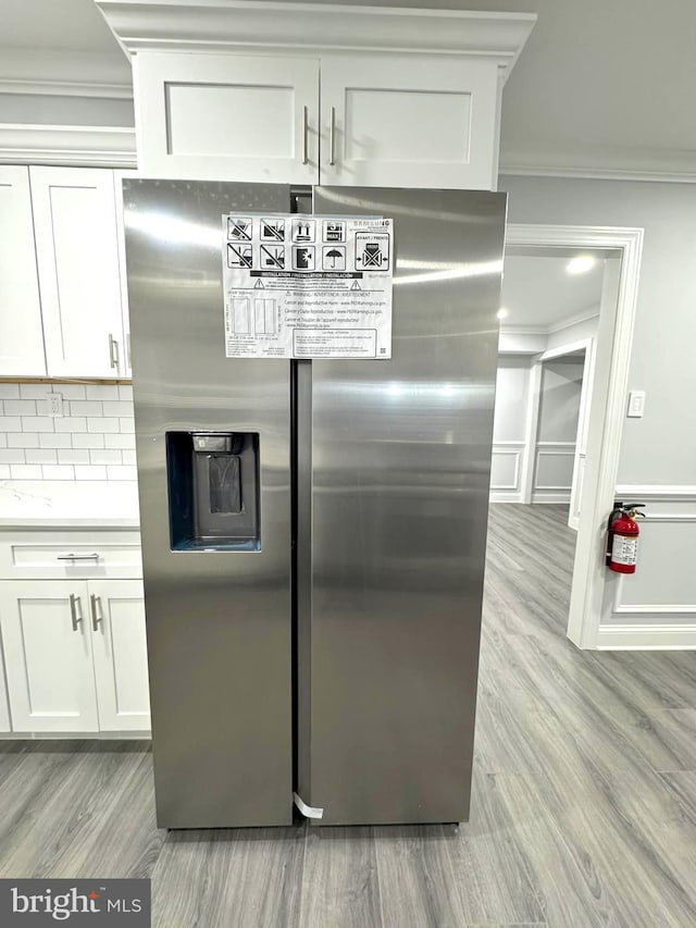 18 Grayson Cir, Willingboro, NJ 08046 - kitchen with ornamental molding, white cabinets, stainless steel refrigerator with ice dispenser, and light wood-type flooring