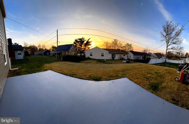 18 Grayson Cir, Willingboro, NJ 08046 - yard at dusk with a patio, fence, and a residential view