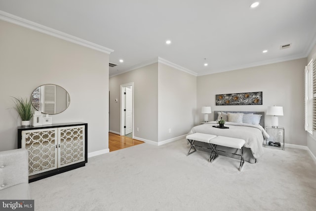 carpeted bedroom featuring baseboards, visible vents, recessed lighting, and ornamental molding