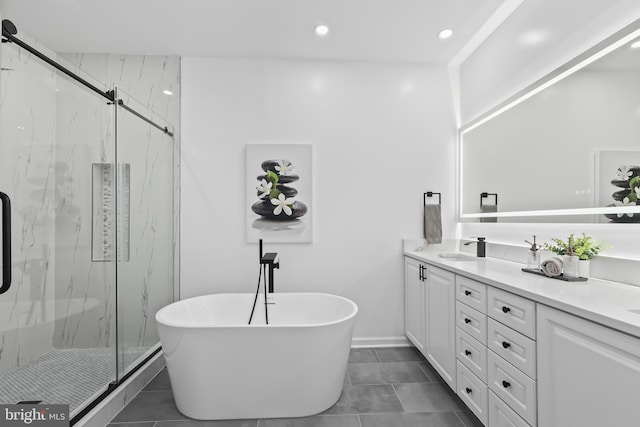bathroom featuring a soaking tub, tile patterned floors, vanity, and a marble finish shower