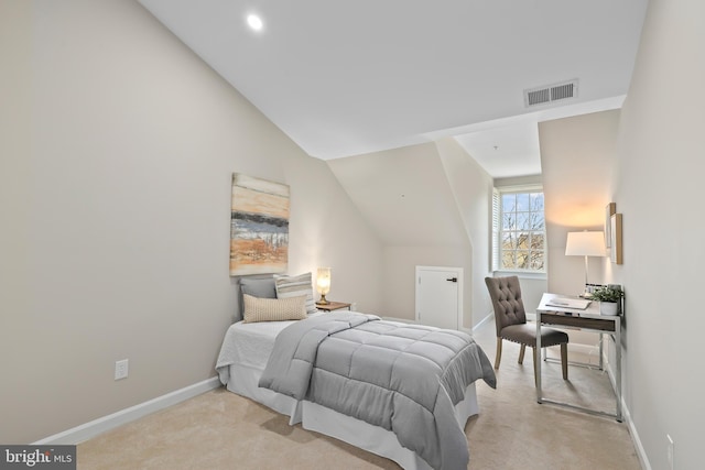 bedroom with light carpet, baseboards, visible vents, and vaulted ceiling