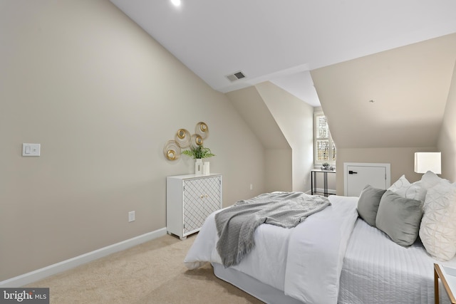 bedroom with lofted ceiling, light carpet, baseboards, and visible vents