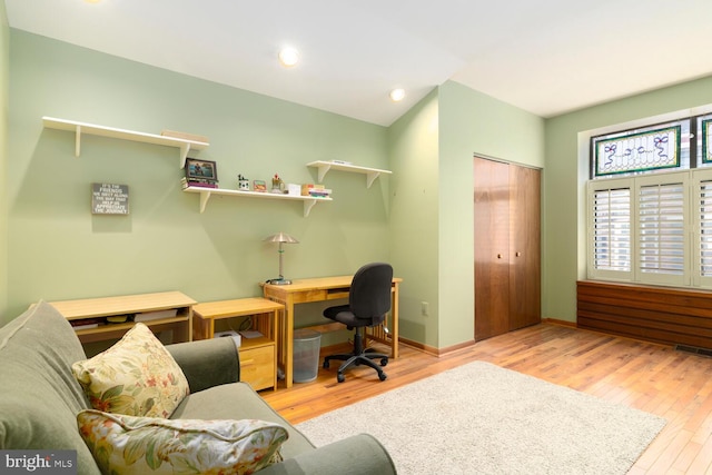 office with visible vents, recessed lighting, baseboards, and wood finished floors
