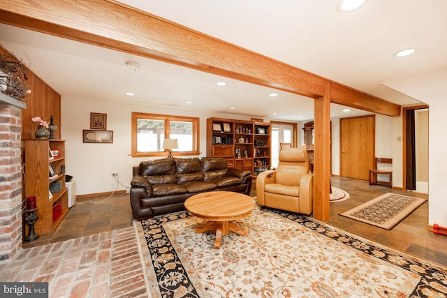 living room with baseboards, a healthy amount of sunlight, and recessed lighting