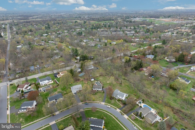 birds eye view of property with a residential view