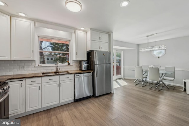 6 Walnut Dr, Burlington, NJ 08016 - kitchen with tasteful backsplash, plenty of natural light, appliances with stainless steel finishes, and a sink