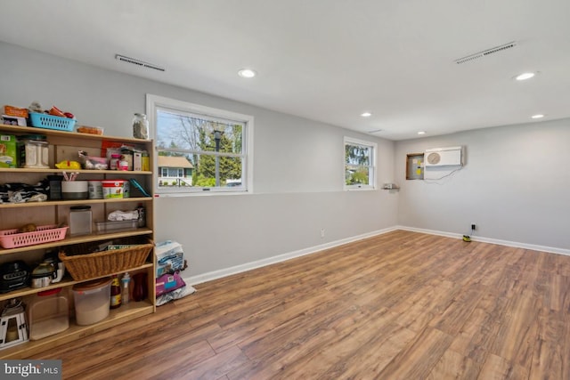 6 Walnut Dr, Burlington, NJ 08016 - below grade area featuring a healthy amount of sunlight, wood finished floors, and visible vents