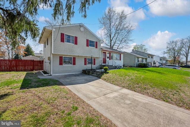 6 Walnut Dr, Burlington, NJ 08016 - tri-level home featuring fence, driveway, and a front yard