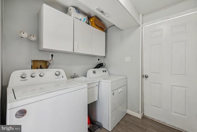 6 Walnut Dr, Burlington, NJ 08016 - laundry area with wood finished floors, a sink, washer and dryer, cabinet space, and visible vents