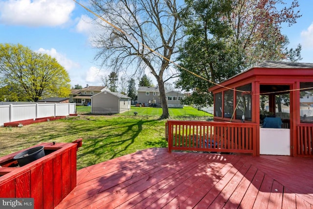 6 Walnut Dr, Burlington, NJ 08016 - wooden deck featuring fence, a lawn, a sunroom, and a residential view