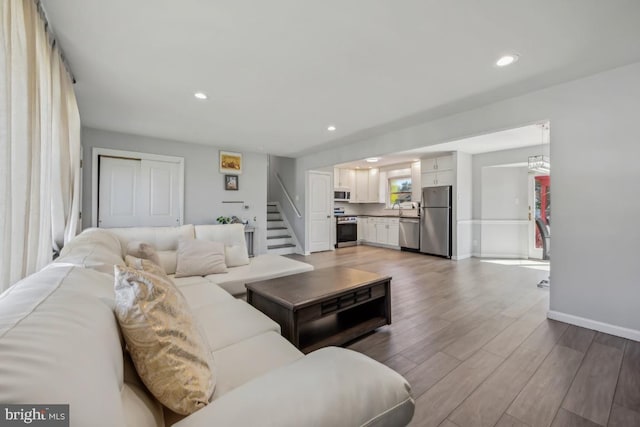 6 Walnut Dr, Burlington, NJ 08016 - living room featuring recessed lighting, wood finished floors, baseboards, and stairs