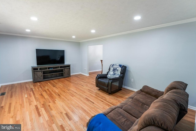 living area featuring recessed lighting, baseboards, and wood finished floors