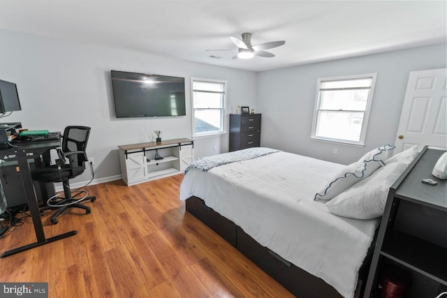 bedroom featuring ceiling fan and wood finished floors