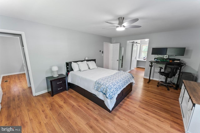 bedroom featuring baseboards, ceiling fan, and light wood-type flooring