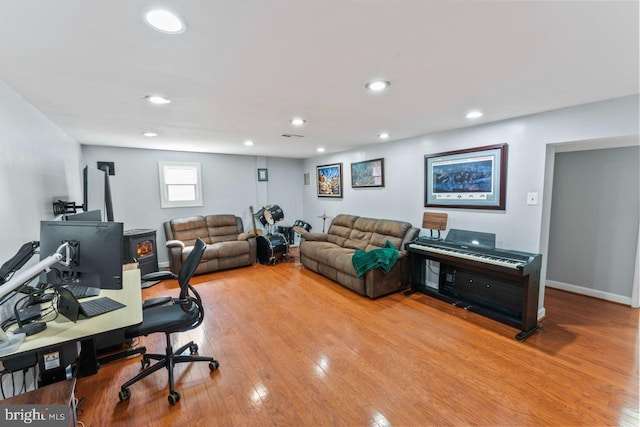 office space with baseboards, recessed lighting, and wood finished floors