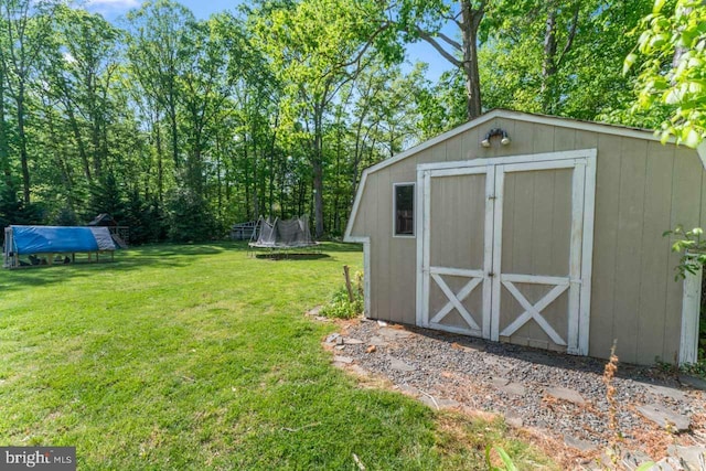 view of shed with a trampoline