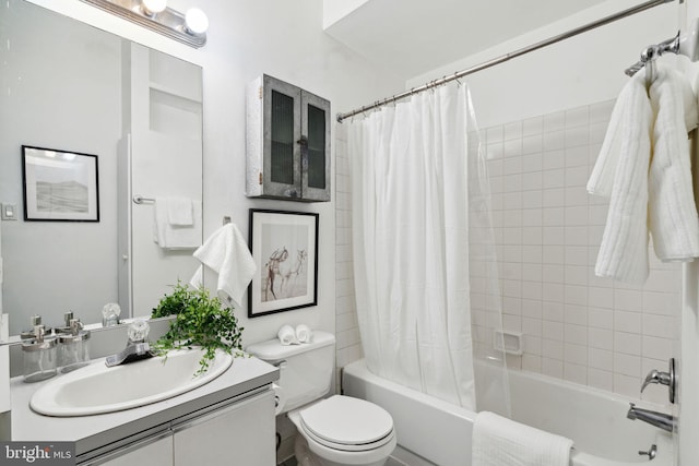 full bath featuring shower / tub combo, toilet, and vanity