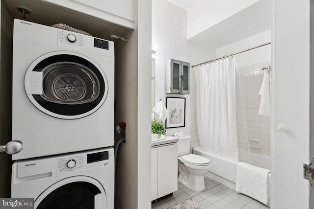 laundry room with radiator heating unit, stacked washer / dryer, laundry area, and light tile patterned flooring